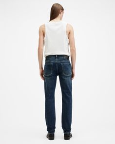 Your go-to jeans just got even better. The Iggy are a classic slim fitting style with a laidback feel that takes inspiration from workwear styles (take note of the reinforced belt loops). Masterfully crafted from soft-to-touch organic cotton with a little bit of stretch, we've updated this signature fit with clean, modern details. You'll find embossed leather patches on the waistband and new printed pocket linings.  In honor of our 30th anniversary, we've relaunched the AllSaints denim collection. Get to know the core staples – we've made them even better than before. These jeans are designed to be slim fitting Button closure Mid-rise Five pocket construction Slight stretch to the denim Reinforced back pockets Interior printed pocket bags Embossed leather patch on the waistband Embossed le Workwear Fashion, Going Out Outfits, 30th Anniversary, Sweater Sale, Sweaters And Jeans, Clean Modern, New Print, Leather Patches, Indigo Blue