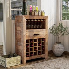 a wooden cabinet with wine glasses and bottles in it next to a potted plant