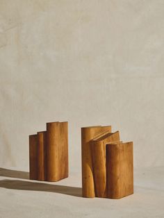 three pieces of wood sitting next to each other