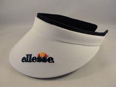 This is a new Ellesse Womens vintage tennis golf visorStyle: Vintage Condition: New Color: WhiteSize: One size fits most• Authentic Ellesse visor• Ellesse name and logo on front• Ellesse logo on underbrim• Rare vintage visor Sporty White Visor For Summer, White Breathable Casual Visor, Casual White Breathable Visor, White Casual Visor For Sports, White Casual Sports Visor, Sporty White Visor For Outdoor, Casual Sports Event Visor, Adjustable White Curved Visor, Adjustable White Visor For Sports Events