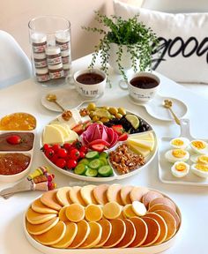 a table topped with plates and bowls filled with food