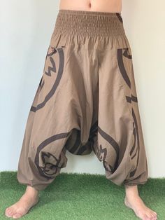 "Bohemian pant Styles Smock Waist Low Crotch Bohemian Harem cotton pants in Traditional Prints Thai hilltribe with drop crotch style make you feel very comfy. Elastic waist is available to fit you all, so that you can wear it easily and feel comfortable. Wear it often as you want. Shipping & Handling * Parcels will be ship via DHL Express Fabric: Light Thai cotton Each print is unique so yours may differ in detail, color, and pattern from that pictured but will be similar. From our experienc Brown Casual Pants For Festivals, Casual Brown Pants For Festival, Bohemian Brown Cotton Pants, Hippie Style Brown Bottoms For Festival, Brown Hippie Bottoms For Festival, Hippie Style Brown Festival Bottoms, Bohemian Brown Pants For Festival, Brown Bohemian Pants For Festival, Bohemian Brown Pants With Pockets