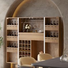 a wine rack in the middle of a room with two chairs and a table next to it