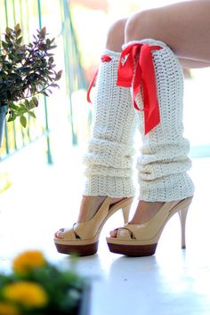 This cozy and chic pair of leg warmers features a super-soft crochet stitch in an extra long length...topped-off with red satin ties!! An elastic band keeps them comfortably in place, making them perfectly practical and fashionable for dancers and fashionistas alike!!♥Available in a rainbow of colors!! (Shown in 'Ivory with Red Ties')...If you would like custom colors not listed in the dropdown menu, please feel free to leave a note in the message-to-the-seller section of your order. Yarn colors Crochet Fitted Leg Warmers For Winter, Cozy Crochet Fitted Leg Warmers, Cozy Fitted Crochet Leg Warmers, Fitted Crochet Leg Warmers For Winter, Cozy Cream Fitted Leg Warmers, Cozy Fitted Cream Leg Warmers, Fitted Cream Leg Warmers For Winter, Fitted Cream Leg Warmers For Fall, Leg Warmers Pattern