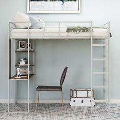 a white bunk bed sitting next to a desk and chair