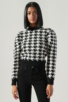 Chic to the max. Instantly elevate your outfit in this houndstooth sweater. Features a high neckline that tops a cropped bodice. Gathered shoulders create voluminous long sleeves. Ribbed cuffs and a sweep finish off the look. Easily wear it with your favorite black denim and boots for an effortless edgy look.- Cropped- Gathered shoulder- High neckline- Houndstooth- Color: Comes in 2 colorsSize + Fit - Model is 5'9" and wearing size XS- Measurements taken from size S - Chest: 33 1/2"- Length: 20" Denim And Boots, Kids Kimono, Houndstooth Sweater, Black And White Sweater, Plus Size Romper, Classic Sweater, White Houndstooth, Stylish Clothes For Women, Bralette Tops