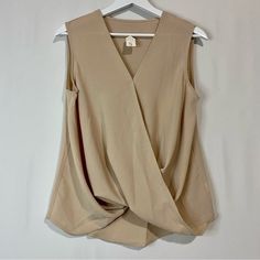 Women’s Sleeveless Faux Wrap V Neck Blouse Tan Size Large New Without Tags Approximate Hanging Measurements Shown In Photos 95% Polyester 5% Spandex Business Casual Summer Sleeveless Girly V Neck *Size Small Sold Versatile Tank Vest For Workwear, Beige Tank Top For Work, Versatile Sleeveless Office Vest, Versatile Sleeveless Vest For Office, V-neck Blouse With Vest For Work, Beige Sleeveless Blouse Tank Top For Workwear, Sleeveless Beige Workwear Blouse, Sleeveless Beige Blouse For Work, Beige Sleeveless Blouse For Workwear