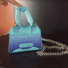 Steve Madden Bdoraa Turquoise Micro Mini Sliver Chain Crossbody Bag Purse Nwt$98 New With Tag Same Day Shipping Smoke And Pets Free Add A Pop Of Color To Your Outfit With This Steve Madden Bdoraa Crossbody Bag. The Turquoise Exterior Is Made Of High-Quality Faux Leather And Features A Silver Chain Strap For A Touch Of Glamour. The Bag Measures 6 Inches In Width, 5 Inches In Height, And 2 Inches In Depth, Making It The Perfect Size For Carrying Your Essentials. The Bag's Closure Is Secure With A Designer Blue Bag With Chain Strap, Trendy Turquoise Shoulder Bag, Trendy Blue Bag As Fashion Accessory, Blue Top Handle Shoulder Bag With Chain Strap, Blue Shoulder Bag With Top Handle And Chain Strap, Brand Card, Turquoise Fabric, Blue Purse, Chain Crossbody Bag