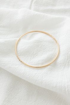 14k gold filled 2mm hammered textured bangle Please note: this bangle is hand-stamped so the stamping may not be perfect If you would like a different length that is not listed, please contact us for a custom order! Finding Your Size We recommend using a flexible measuring tape to wrap around your wrist to find the length of your preferred fit. An alternative to this is getting a piece of string or shoelace, wrap that around your wrist, and measure the length in inches Everyday Hammered Bangle Bracelets, Everyday Hammered Bangle Bracelet, Everyday Gold Hammered Bangle, Dainty Rose Gold Everyday Bangle, Everyday 14k Rose Gold Bangle, Everyday Gold Hammered Cuff Bracelet, Everyday 14k Gold-filled Bangle Bracelet, Everyday 14k Gold Filled Bangle Bracelet, Minimalist Hammered Bangle For Everyday