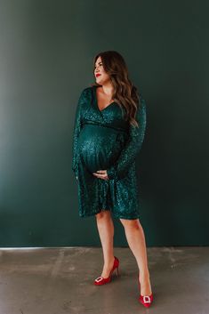 Our top-selling sequin wrap dress is back in a new, stunning Hunter green color. Designed in collaboration with Sarah Tripp. This dress is a best-seller for good reason! Wrap dress is adjustable to your body, nursing friendly, and maternity friendly. Look and feel glamorous at your next Holiday party. Fully adjustable wrap dress Snap button closure at bust Long sleeve Nursing friendly Maternity friendly Knee length Fully lined: 100% polyester lining 95% polyester, 5% spandex Pink Desert Brand Ru Dress Snap, Sequin Wrap Dress, Hunter Green Color, Pink Desert, Nursing Friendly, Next Holiday, Hunter Green, Top Selling, Holiday Party