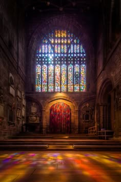 an empty church with stained glass windows