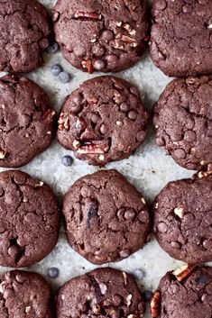 chocolate cookies with pecans in the middle