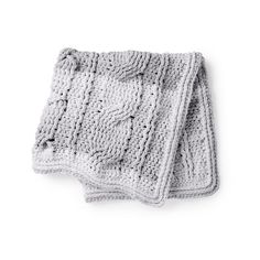 two crocheted blankets on top of each other, one is gray and the other is white