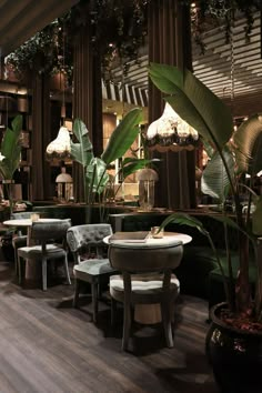 the interior of a restaurant with tables and chairs