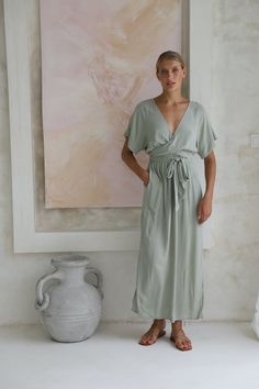 Chic Flowy V-neck Wrap Dress, Chic V-neck Rayon Maxi Dress, V-neck Tie Waist Dress For Daywear, V-neck Dress With Elastic Waistband For Daywear, Summer Viscose V-neck Wrap Dress, V-neck Viscose Dresses For Loungewear, Feminine Rayon V-neck Midi Dress, Elegant V-neck Midi Dress With Elastic Waistband, Flowy V-neck Midi Dress For Loungewear