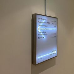 a large screen mounted to the side of a wall