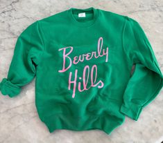 Soft Kelly green  sweatshirt with a cute pink print. We have the adult size to match as well!  So you can Twin  Unisex youth sizes Med to youth xl Small 6-8 yrs old  Med - 8-10 yrs old Large 12-14 Xlarge. 14-16  Matching adult sizes also listed 💗 Pink Pre-shrunk Cotton Sweatshirt, Trendy Green Sweatshirt With Text Print, Casual Pink Pre-shrunk Sweatshirt, Cute Green Sweatshirt With Letter Print, Cute Green Tops With Name Print, Relaxed Fit Pink Top With Lettering, Green Crew Neck Sweatshirt With Screen Print, Green Pre-shrunk Long Sleeve Top, Green Pre-shrunk Relaxed Fit Sweatshirt