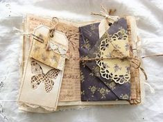 an open book with lace and paper on it