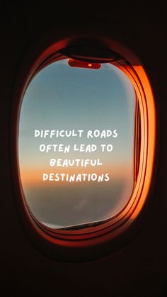 an airplane window with the words difficult roads often lead to beautiful destinations