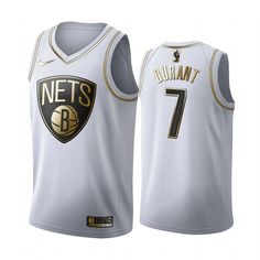 a white jersey with the number seven on it and gold lettering that reads, nets