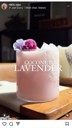 an image of a pink cake with coconut and lavender flowers on the top that says coconut lavender