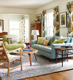 a living room with two couches and a coffee table in front of the window