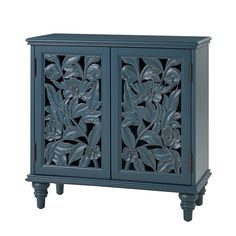 an ornate blue cabinet with carved flowers on the front and bottom doors, is shown against a white background