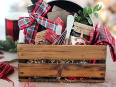 a wooden crate filled with food and utensils