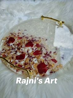 a glass plate with food on it sitting on top of a white fur covered floor