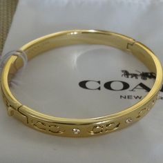 This Is A Brand New With Tags Coach Bangle With Dust Bag In Gold Color. Retail $88 Shipping Information This Item Is Shipped Within The Us Only. Your Order Will Be Dispatched Within Two Working Days Of Receiving Payment (Monday-Friday) Expensive Gold Bracelet, Gold Dangle Bracelet, Coach Bracelets Gold, Luxury Brand Bracelets, Real Gold Bracelets, Luxury Gifts For Girlfriend, Coach Bangle Bracelet, Coach Bracelets Bangles, Gold Jewelry Bracelet Stack