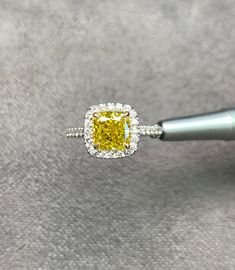 Diamond Engagement Ring, 2.11 Carat GIA Cushion Cut Diamond, Diamond Ring, Engagement Ring, GIA Diamond Fancy Vivid Yellow Diamond, 18k Gold Gold metal: 18K White gold Diamond Shape: Cushion Cut Main Stone: 1.76 Ct Side Stones: 0.35 Carats Total Carat Weight: 2.11 Ct Color: Fancy Vivid Yellow Treated HPHT Clarity: VVS2 Comments: Natural Diamond HPHT Side Stones Clarity: VVS Side Stones Color: E-F Cut: Excellent All products come with a Certificate. Please feel free to contact me for any question Dazzling Yellow Rings With Halo Setting, Gia Certified Diamond Cluster Halo Ring, Exquisite Gia Certified Diamond Ring Cushion Cut, Yellow Platinum Diamond Ring Fine Jewelry, Exquisite Gia Certified Cushion Cut Diamond Ring, Yellow Diamond Ring With Halo Setting, Fine Jewelry Yellow Diamond Platinum Ring, Yellow Platinum Diamond Ring, Gia Certified Cushion Cut Diamond Ring