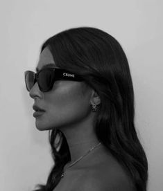 a woman wearing sunglasses with the word cline on it