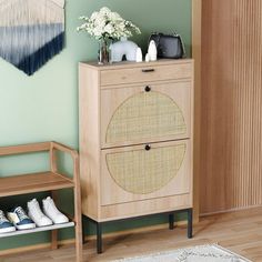 a wooden cabinet sitting next to a white rug