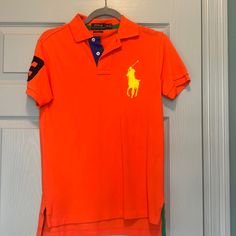 This Is A Great Fun Bulb, Pablo, Men’s Extra Large Custom Fit Bright Orange With An Enlarged Yellow Polo Horse Number Three In Blue On The Sleeve. Excellent Condition. Polo Horse, Blue's Clues, Blue’s Clues, Number Three, Ralph Lauren Shirt, Bright Orange, Orange Yellow, Custom Fit, Polo Ralph