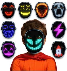 a young boy wearing an orange shirt and black mask with different colored lights on his face