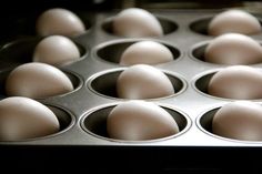 an image of eggs in a muffin tray with the words, place the eggs in a muffin tray so they don't move around, turn them to