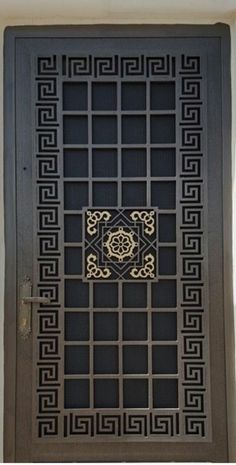 an iron door with decorative designs on it