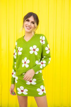 Have you seen a more magical sweater set? The Flower Power sweater is a v-neck sweater top featuring a flower pattern. Pair with the Flower Power Skirt to complete the look. True to size. Model is 5'7 wearing size small/medium Get the set! Flower Power Skirt https://www.aspynandivy.com/products/copy-of-green-flower-skirt?_pos=1&_sid=f4b5d0a7b&_ss=r Seize the Day Yellow Trouser Pants https://www.aspynandivy.com/products/yellow-pants?_pos=1&_sid=777427e21&_ss=r 70% ACRYLIC 30% NYLON Width: Length: Green V-neck Sweater For Spring, V-neck Sweater With Floral Print For Fall, Green V-neck Spring Sweater, Cute V-neck Sweater For Spring, Fitted Cotton V-neck Sweater For Spring, Playful Fitted Spring Sweater, Spring Cotton V-neck Sweater, Flower Sweater, Rainbow Outfit