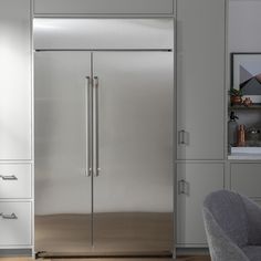 a large stainless steel refrigerator in a kitchen