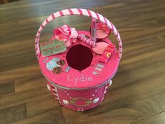 a pink basket filled with lots of candy