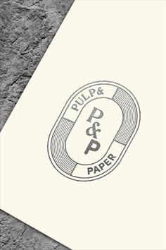 the logo for pulp and paper is shown on a piece of white paper with black ink