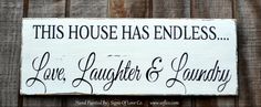 this house has endless love, laughter and laundry hand painted wood sign on an old fence