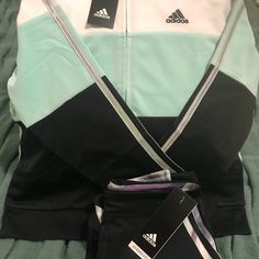 Product Description Track Suit - Girl's Size M (10-12) 100% Polyester. Cold Machine Washing, Low Temperature Drying. Imported. Size: Length: 48.3 Cm. Sleeve Length: 58.4 Cm. Adidas Sports Set With Long Sleeve, Adidas Casual Sportswear Sets, White Long Sleeve Color Block Sets, White Stretch Activewear For Play, Sporty Color Block White Sets, Adidas Sporty Playwear Sets, Sporty Fitted Adidas Sets, White Activewear For Spring Playwear, White Spring Activewear For Play