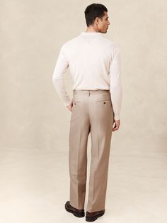 This relaxed pant is expertly cut with a wide leg and puddle hem from an Italian wool fabric we love for its subtle twill texture.  Designed to carry you through all seasons, this beautiful fabric is woven in a Super 120's weight--the perfect balance of fine handfeel, beautiful drape, and everyday durability.  Wrinkle-Resistant, Breathable, Stretch Mid rise.  Wide leg with extra length for a break at the hem Fabric from Italy's Lanificio Guabello.  Zip-fly with button closure.  Belt loops.  Four-pocket styling.  Wide-leg fit: High rise.  Tailored for the at-ease fit of traditional trousers, but with the extra wide-leg and full length of puddle-hem pants.  Wide leg opening measures 10" flat.  Inseams: Short 28. 5", Regular 30. 5", Tall 33. 5" Model: Size 32 Regular, 6'2" (188cm). How To Hem Pants, Beautiful Drapes, Khaki Color, Wool Fabric, Beautiful Fabric, Mens Suits, All Seasons, Wide Leg Pants, Fashion News