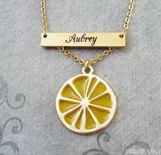 Lemon Necklace Lemon Jewelry Lemon Charm Necklace STAINLESS STEEL Bar Necklace Personalized Jewelry Name Necklace Custom Engraved Necklace This listing is for a lemon necklace with an engraved bar personalized with a name. Just send us a name in a note during checkout. Character limit of 15, including spaces. You can pay to have both sides engraved by using the drop-down menu. See the secondary photos for charm scale and font options. Want something special engraved? Just ask! Please see the sec Yellow Charm Necklace With Adjustable Chain As Gift, Yellow Pendant Jewelry With Lobster Clasp, Trendy Lime Green Jewelry Gift, Trendy Lime Green Jewelry For Gift, Trendy Yellow Necklace With Adjustable Chain, Trendy Lime Green Jewelry As A Gift, Trendy Personalized Yellow Jewelry, Yellow Charm Necklace With Lobster Clasp For Gift, Elegant Yellow Charm Necklaces For Gifts