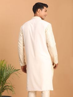 Vastramay Men's Cream Golden Sequin Embroidered Kurta Elevate your ethnic wardrobe with this stunning cream kurta from VASTRAMAY. It features intricate golden sequin embroidery that adds a touch of glamour. Made from high-quality fabric, this kurta ensures comfort and style. Perfect for festive occasions and weddings. Features: Intricate golden sequin embroidery High-quality fabric Comfortable and stylish Perfect for festive occasions and weddings Specifications: Brand: VASTRAMAY Color: Cream wi Traditional Gold Embroidered Kurta For Eid, Long Sleeve Kurta With Gold Embroidery For Diwali, Gold Embroidery Long Sleeve Kurta For Diwali, Off White Straight Kurta With Pallu, Off White Long Sleeve Kurta With Zari Work, Off-white Long Sleeve Designer Traditional Wear, Traditional Kurta With Gold Embroidery For Diwali, Traditional Gold Embroidered Kurta For Diwali, Off-white Long Sleeve Kurta With Dabka