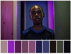 a person standing in front of a door with purple lighting behind them and the color swatches below it