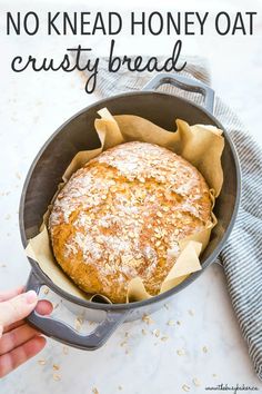 no knead honey oat crusty bread in a cast iron skillet with text overlay