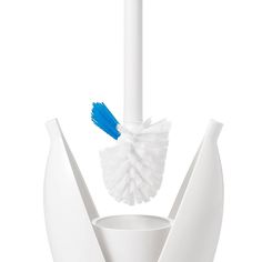 a blue and white toothbrush sitting in a cup on top of a table next to a brush holder