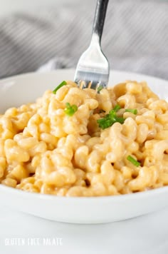 a white bowl filled with macaroni and cheese